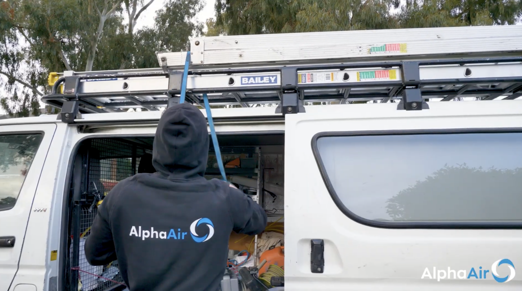 Alpha Air technician preparing ducted heating and cooling installation at a Melbourne home